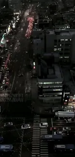 Night cityscape view with bustling traffic and vibrant lights.