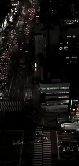 A night view of a bustling city street with illuminating lights and traffic.