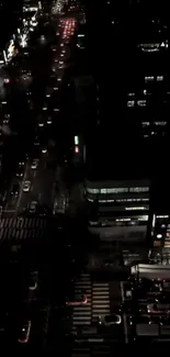 Vibrant night cityscape with illuminated streets and buildings.