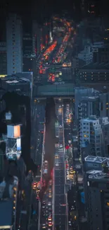 Nighttime city skyline with glowing street lights.