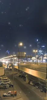 Night cityscape with glowing streetlights and dark sky backdrop.