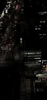 Nighttime cityscape with busy traffic and glowing street lights.