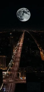 Full moon over cityscape at night with glowing streetlights.