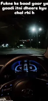 Car dashboard view during nighttime drive on urban roads with glowing streetlights.