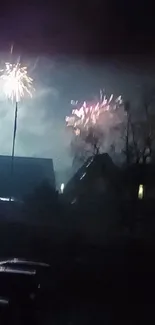 Fireworks light up the night sky over suburban houses.