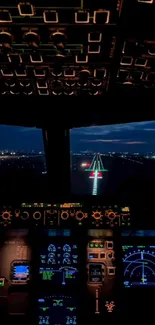 Cockpit view during night landing above city lights.