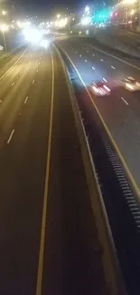 Nighttime highway with car light streaks, urban scenery.