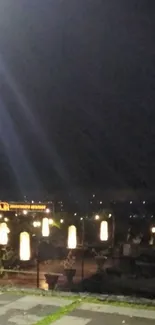 Night cityscape with glowing lights and dark sky.