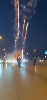 Motorcyclist rides under vibrant fireworks in city nightscape.