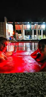 Nighttime pool scene with vibrant red lighting.