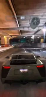 A racing sports car driving through a lit underpass at night.