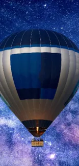 Hot air balloon floating under a starry night sky.