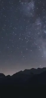 Starry night sky over mountains providing a tranquil view.