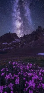 Milky Way over mountains and purple wildflowers at night.