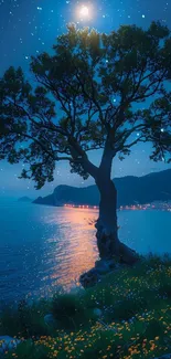 Silhouette of a tree under a moonlit, starry night sky by the coast.