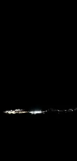 Dark city skyline with faint lights illuminating the horizon.