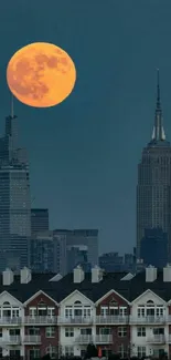 Full moon over city skyline at night.