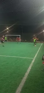 Players enjoying a soccer game on a green field under night lights.