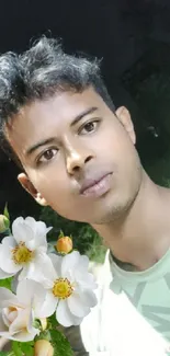 Young individual at night holding flowers on a street, vibrant green hues dominate.