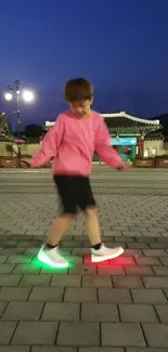 Child in LED sneakers walking under a twilight sky.