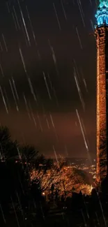 Nighttime tower with rain and city lights.