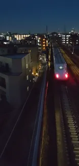 High-speed train racing through city at night.