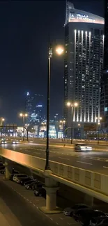 Night cityscape with skyscrapers and illuminated streets.