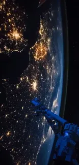 Satellite view of Earth at night with illuminated city lights.