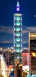 Taipei 101 at night with city skyline in vibrant lights.