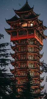 Traditional pagoda with starlit night sky backdrop.