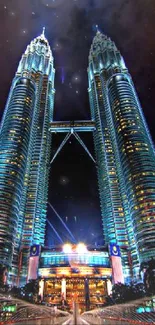 Petronas Towers illuminated at night, showcasing Kuala Lumpur's skyline.