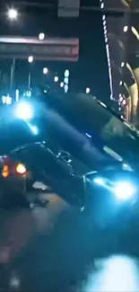 Nighttime car crash scene with bright lights.