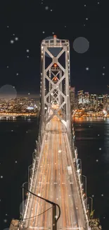 City bridge illuminated against nighttime skyline, shot from front angle.