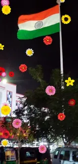 Indian flag waves in city night light scene.