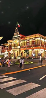 A beautifully lit historic building at night with city lights.