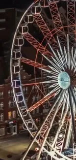 Night view of Ferris wheel with city lights.