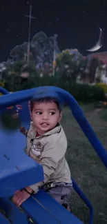 Child exploring a blue playground at night with a crescent moon in the sky.