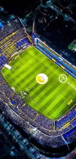 Aerial view of a vibrant stadium at night with colorful illumination.