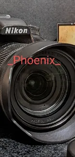 Nikon camera on a black surface with accessories and decorative items.