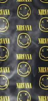 Nirvana smiley face logo on dark wallpaper.