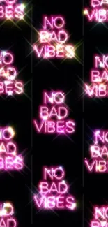 Neon 'No Bad Vibes' text on a black background.