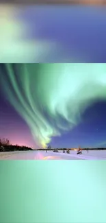 Northern lights illuminating a snowy landscape under a starry sky.