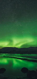 A stunning emerald green aurora over a serene lake at night.