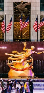 Prometheus statue with ice skaters in Rockefeller Center, NYC.