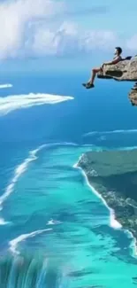 Person on cliff overlooking turquoise ocean waters