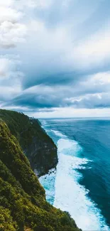 Stunning ocean cliff wallpaper with blue waters and dramatic sky.