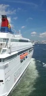 Majestic cruise ship sailing on a blue ocean with a sunny sky.