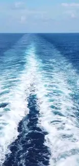 Mobile wallpaper of ocean wake with clear blue horizon.