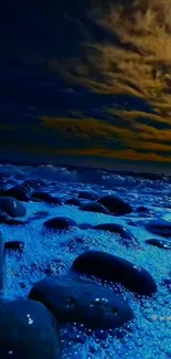 Night sky over calm ocean with blue waves and scenic dark horizon.