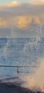 Wave splash against a seaside view with blue ocean and dramatic clouds.